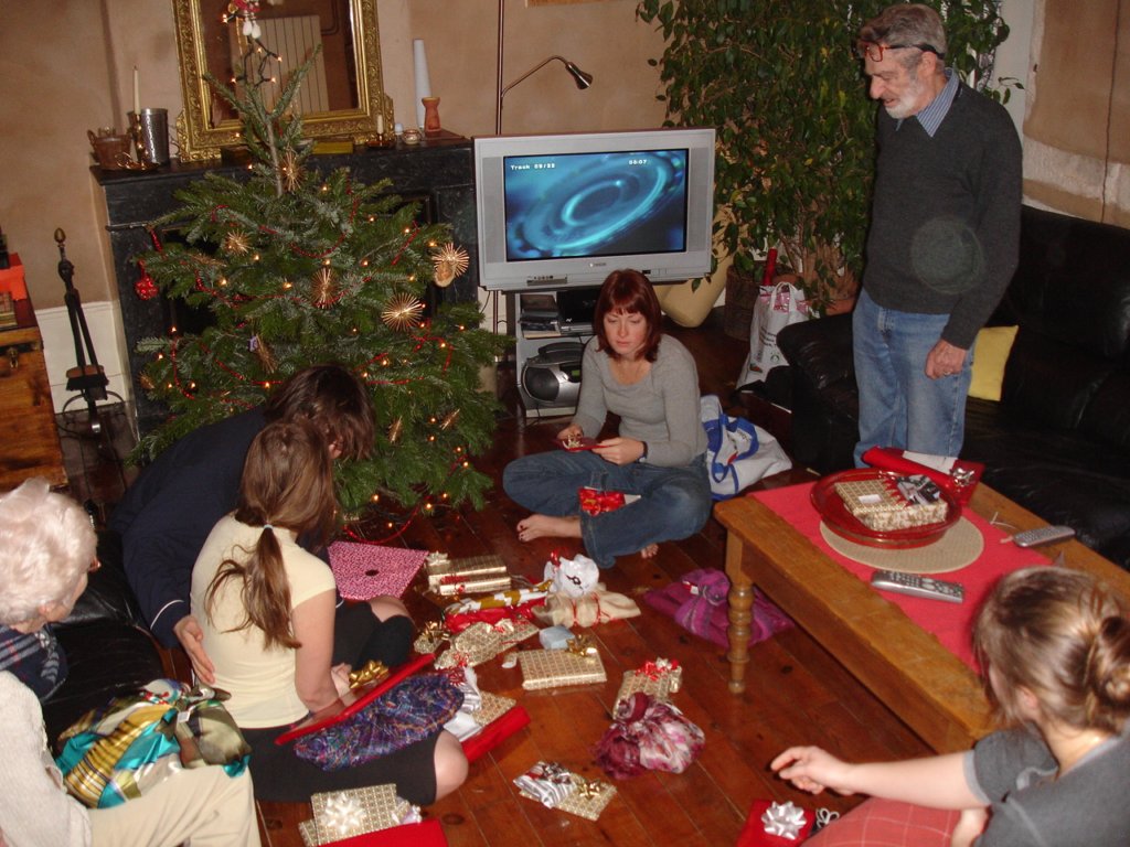 christmasaroundthetreeandgifts.jpg